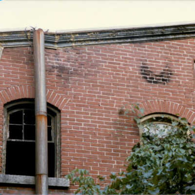 Garrett Snuff Mill before demolition showing details of brickwork and datestone, 1986