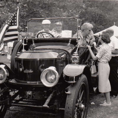 Thomas C Marshall Jr and Lindsey Greenplate in the 1913 Stanley Model 76 touring "Becker" car at Reading Hospital Show, 1961