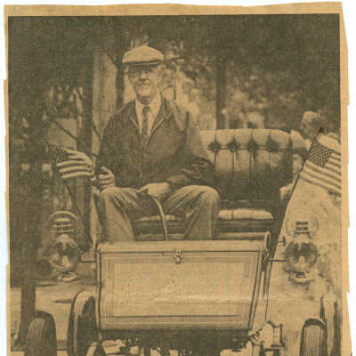 Tom Marshall in Stanley Steamer at benefit fair, c. 1977-1980