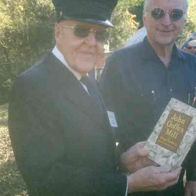 2004 - Thomas C. Marshall, Jr., accepting a gift book from Ernie Ross