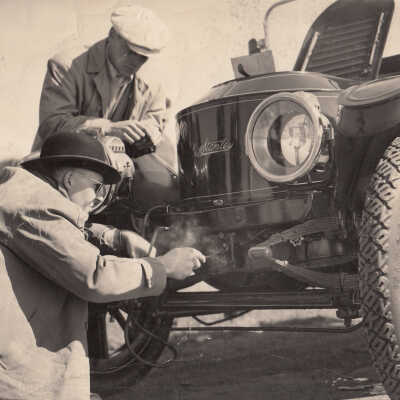 1950 Glidden Tour - Thomas C Marshall Jr repairing the 1913 Stanley Model 78, 1950