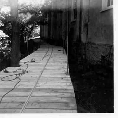 Installation of track on the trestle behind the carriage house, 1960