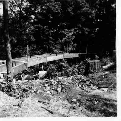 Building of the trestle over the mill race bank, 1960