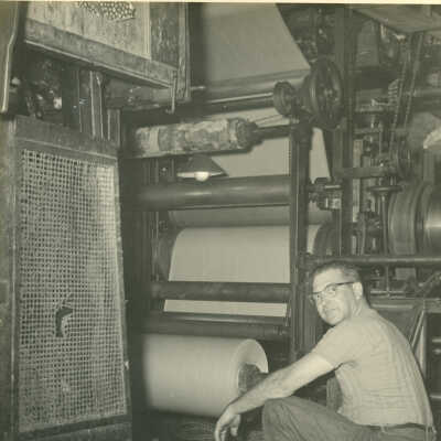 Watson Foote operating the Crowell Tape Mill gummer machine