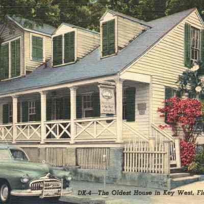 Oldest House Image with Blue Car