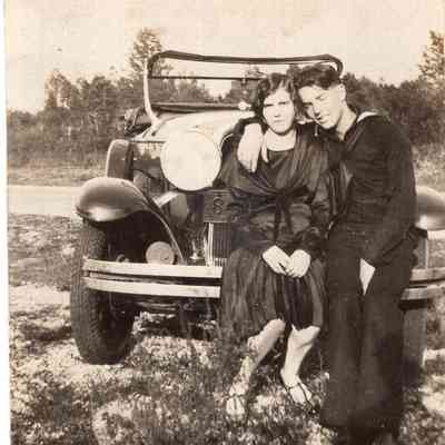 Couple in front of car