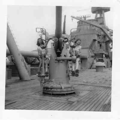 Two girls on 3"/50cal gun