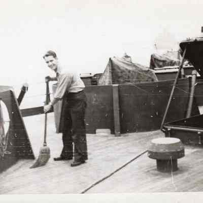 Man sweeps deck