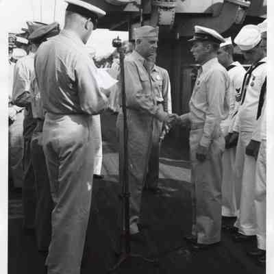 Officer congratulating during ceremony