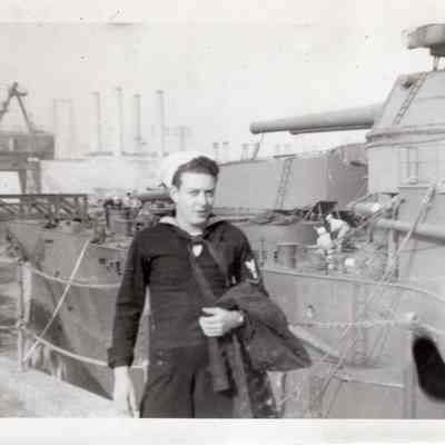 Sailor stands on wing wall