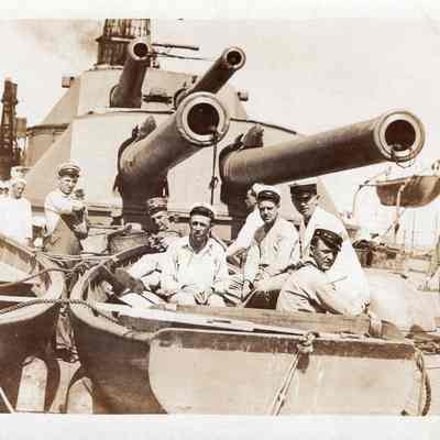 Men in front of turrets