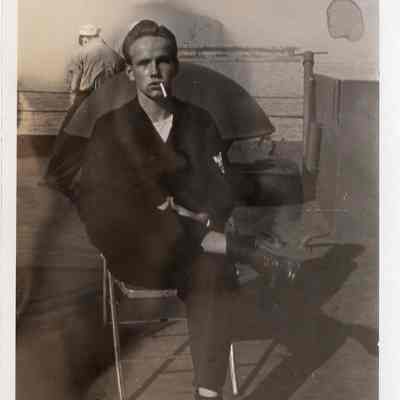 Man smoking in a chair
