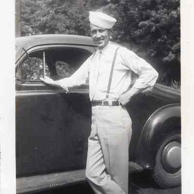 Man posing on car