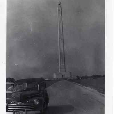 Car driving away from San Jacinto Monument post 1948