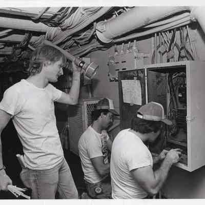 Volunteer electricians fixing equipment