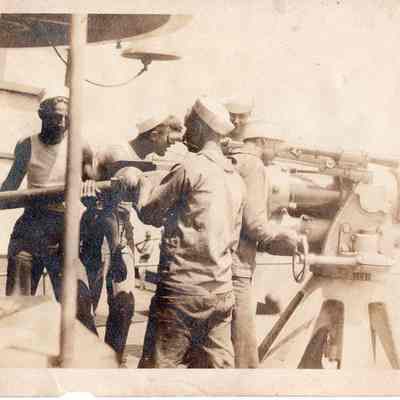 Men loading 3"/50cal gun