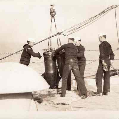 Crane lifting 14" shells