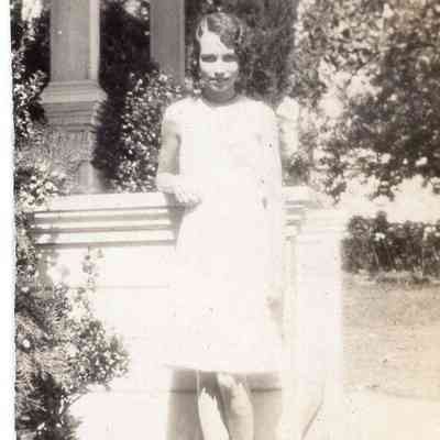 Woman by porch stairs