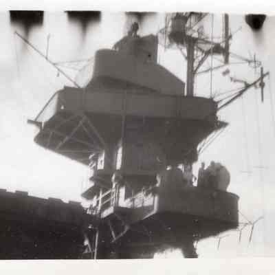 Three men on main mast