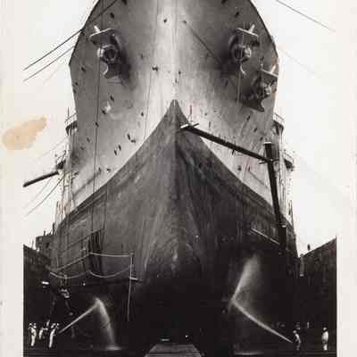 Men cleaning hull in drydock