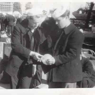 Two men hand off
