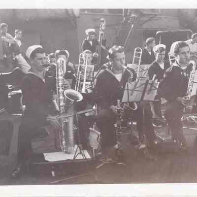 Saxophones playing seated