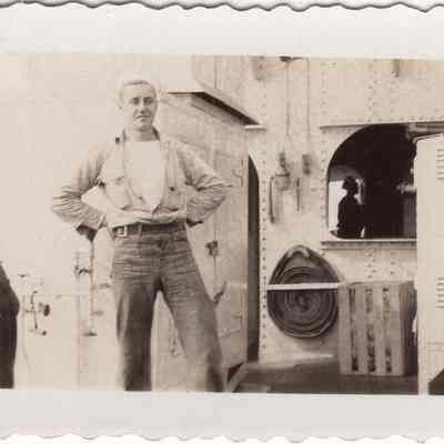 Sailor poses near galley