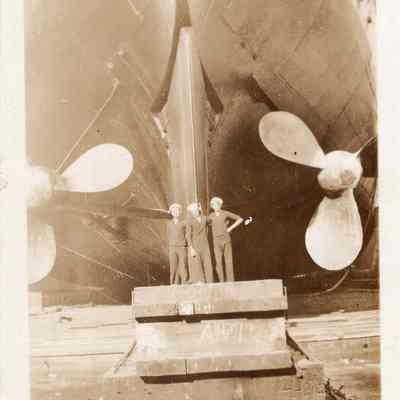 NY sailors pose by stern