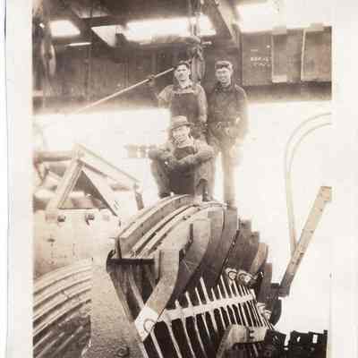 Three men near steel cables