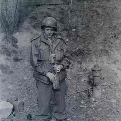 Soldier inspecting pistol