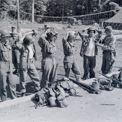 Group of "prisoners" being processed
