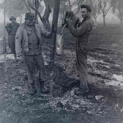Soldiers fueling water heater