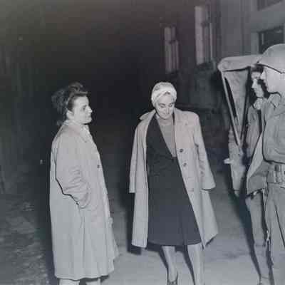 Soldiers with women on the street