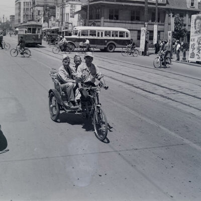 Two soldiers in a pedal cab in Sapporo
