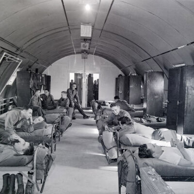 Soldiers relaxing in their Quonset-hut barracks