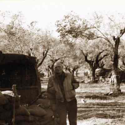 Soldier standing next to Sandbag Shelter
