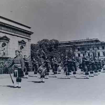 Military band marches during Memorial Day ceremony