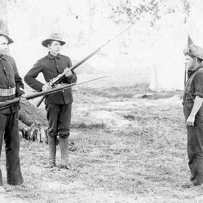 Soldiers posing with Rifles