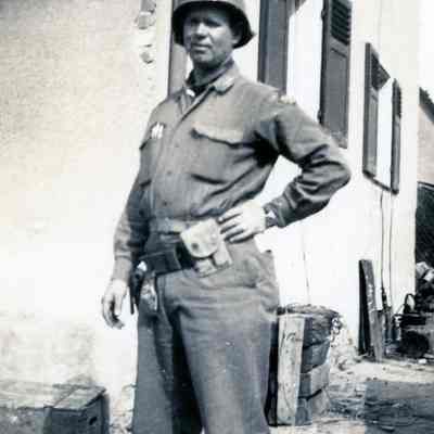 Soldier standing in front of a building