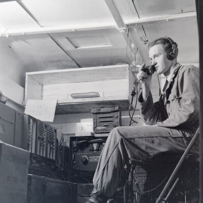 Soldier using radio inside a communication van