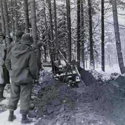 120th Engineers building road through forest