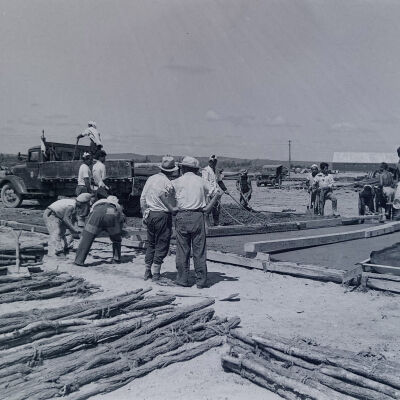 Japanese civilians pouring concrete on Army base
