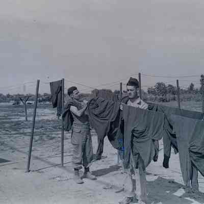 Soldiers hanging clothes to dry