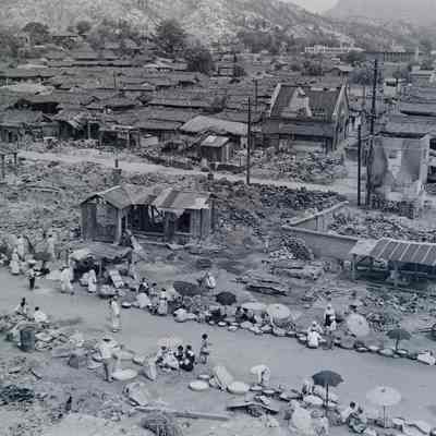 Street market amid destroyed town