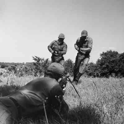 Soldiers enacting an infantry attack