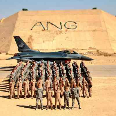 Group photo in front of fighter