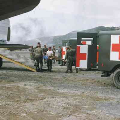 Wounded soldier being loaded onto transport plane