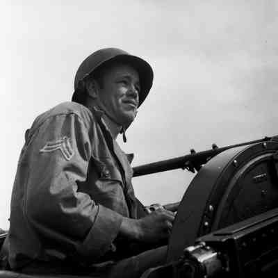 Soldier sitting at an antiaircraft gun