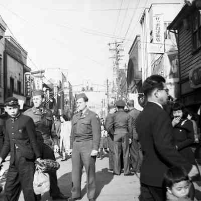 Soldiers and civilians in Sapporo shopping district