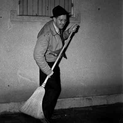 Man holding a broom